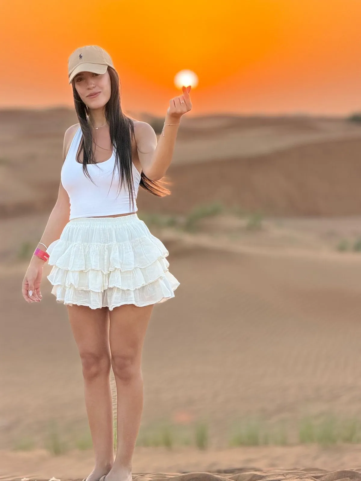 Guest enjoying the sunset in the Dubai desert